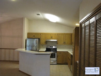 View of kitchen: Neutral colors throughout...high