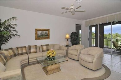 Tiled living area opening to the lanai. Most furni