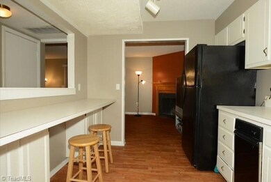 Kitchen has a built in breakfast bar with additional storage underneath.  It is also open into the den giving it a spacious feel and easy access.