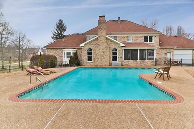 Private back yard with heated pool and aggregate patio