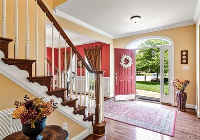 Foyer view to the stairway to the 2nd level and in