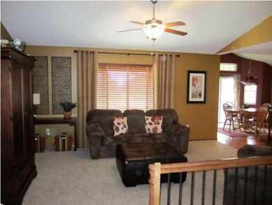 Open livingroom with vaulted celing and large wind