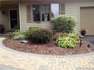 Exterior Front. Professionally landscaped home wit