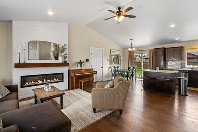 Open living room/kitchen/dining with electric fire