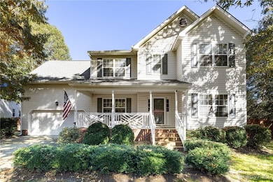Front of property featuring a garage and a porch