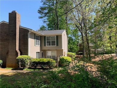 View of side of property with a chimney