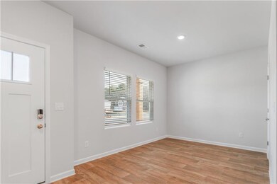 Entryway featuring healthy amount of natural light, light wood finished floors, and recessed lighting