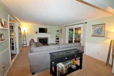 Family Room with Granite-Surround Wood Burning Fir