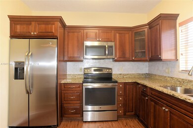 Kitchen - wood cabinetry and granite counters
