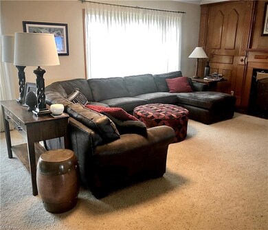 Large living room has two large picture windows an