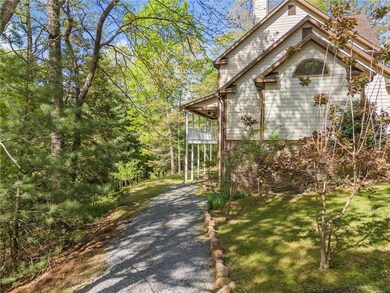 View of home's exterior with driveway, a balcony, 
