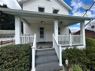 View of exterior entry with a porch