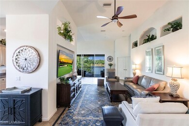 Living room featuring high vaulted ceiling, visibl