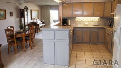 KITCHEN OPEN INTO DINING ROOM
