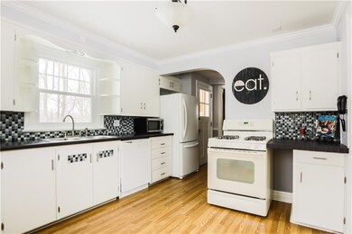 Charming retro kitchen has wood cabinets with lots