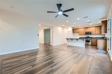 Kitchen featuring baseboards, appliances with stai