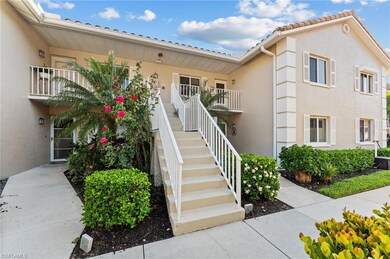 Entrance to property with stucco siding and a tile