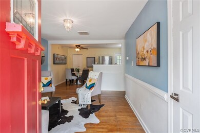 Sitting room with ceiling fan and hardwood / wood-