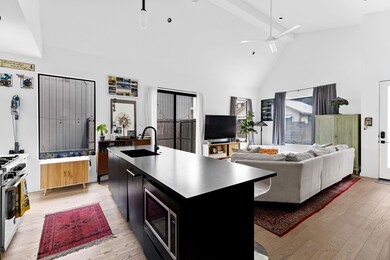 Kitchen with stainless steel appliances, light wo