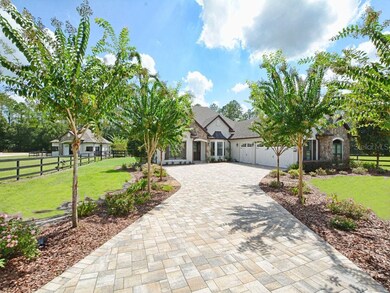 Well established landscaping lines the Brick Paver
