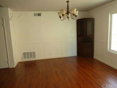 FORMAL DINING AREA WITH BRAND NEW CHANDELIER.