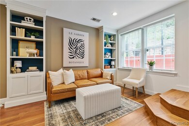 Living room with wood-type flooring, a wealth of n