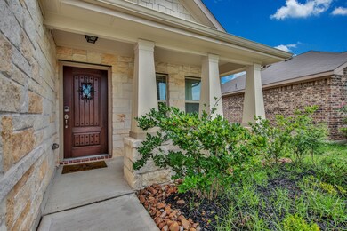 Texas Limestone and covered porch. Security key pad on front door.