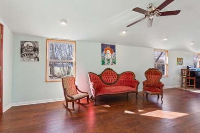 Living room open to Dining and Kitchen areas.