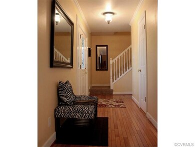 Beautiful hardwood floors flow into the formal din