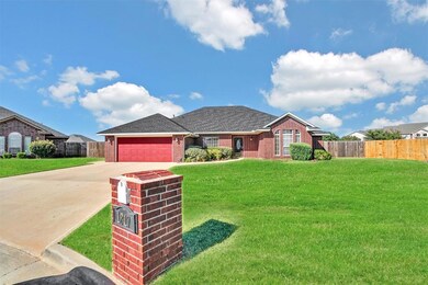View of front of home featuring a garage and a fro