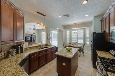 Lovely accent lighting and center island add to th