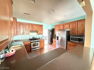 Kitchen with appliances with stainless steel finis