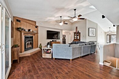 Solid, dramatic fire place mantle. Two gas log fire places, one on each level with blowers for efficiency.