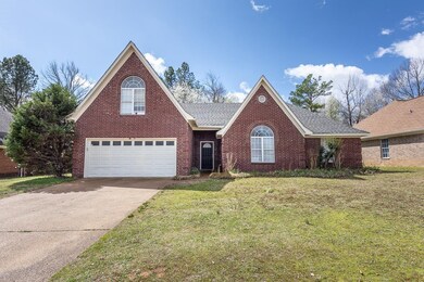 Traditional-style house featuring a front lawn, br