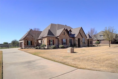 Front view with concrete driveway and 3-car attach
