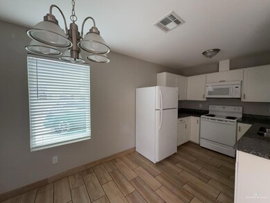 Unfurnished dining area with plenty of natural light and an inviting chandelier
