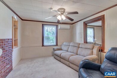 Across from the kitchen with openings through to D