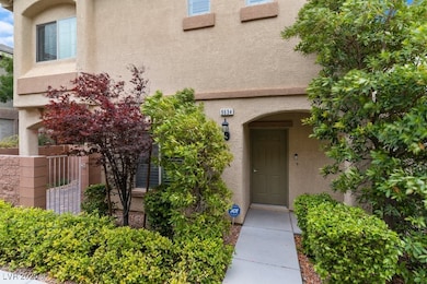 View of exterior entry featuring stucco siding
