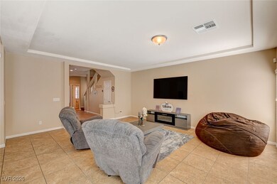 Living room featuring light tile patterned floors,