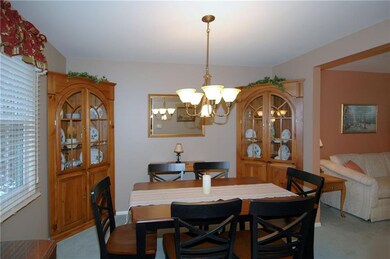 DINING ROOM OPENS TO THE LIVING ROOM AND KITCHEN