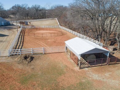view of  covered hay storage and riding arena
