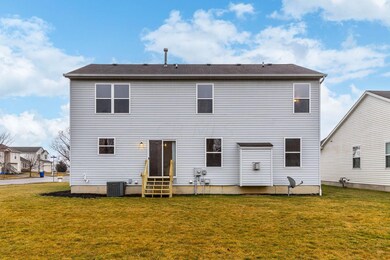 back of home, newer A/C unit