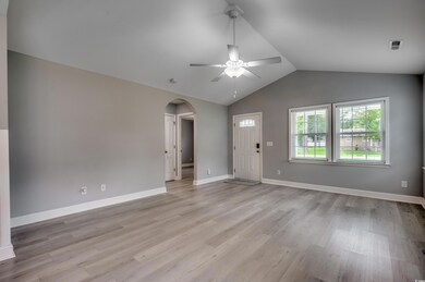 Empty room with ceiling fan, light hardwood / wood
