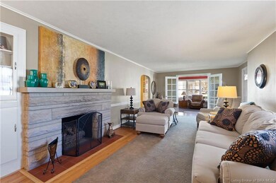 SPACIOUS LIVING ROOM HAS A GAS FIREPLACE