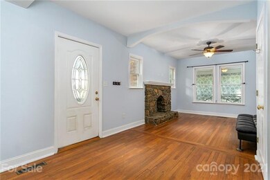 Feel the charm of original 1920's home.  Stone fire place, wooden floors, archway. Fire place non operable but so warm and beautiful. Buyer could explore gas logs option.