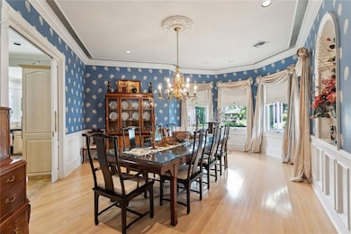 Dining room: Pickled oak flooring, Brass chandelier, Shell 