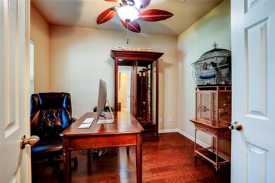 Walk inside and you're greeted by french doors leading into a private study. Updated wood floors and elegant ceiling fan!