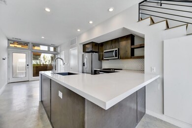Kitchen with stainless steel appliances, a sink, 