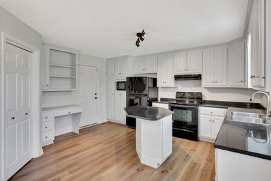 The laundry room is located behind those double doors and just look at all the counter space!