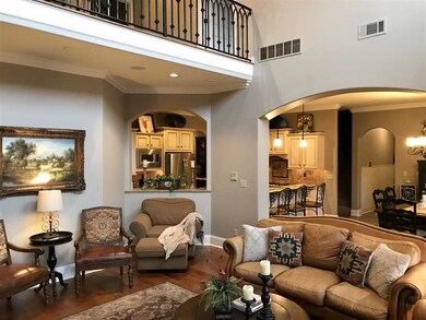 Two story family room with a beautiful real masonr